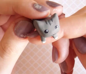 Cat dust plug for cell phone